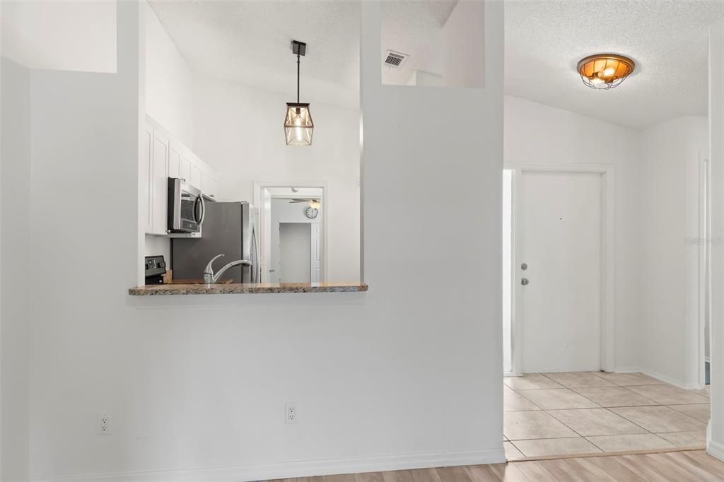 Family room with sliders to enclosed porch.