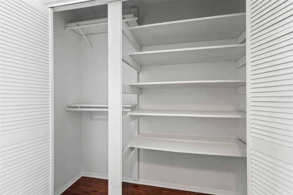 Primary bedroom walk in closet