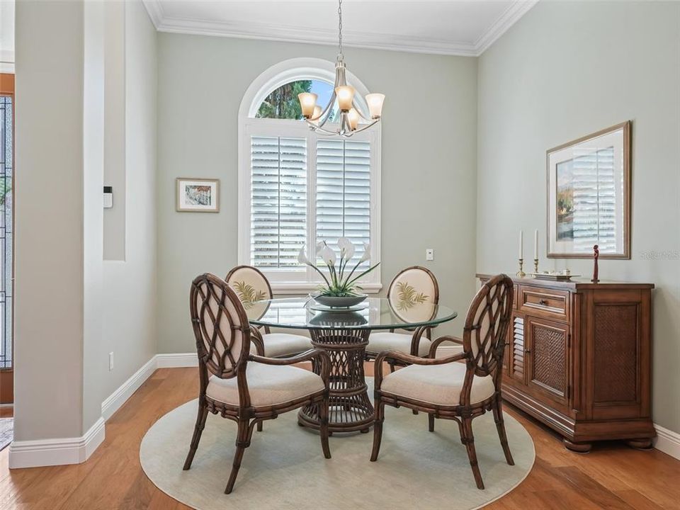 Dining room with new window, plantation shutters, and room for entertaining