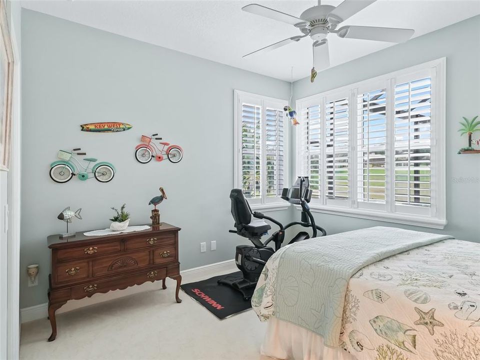 3rd bedroom has plantation shutters, 3 nice size windows, a fan and a large closet.