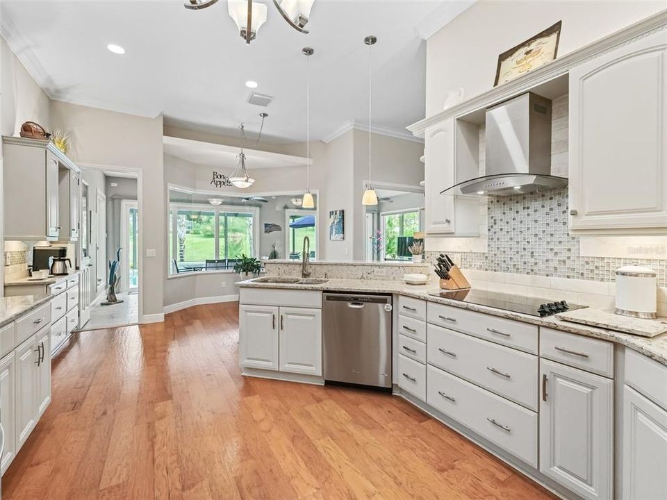 The crown molding on the kitchen cabinets and coordinating lighting fixtures add a lot to this space.