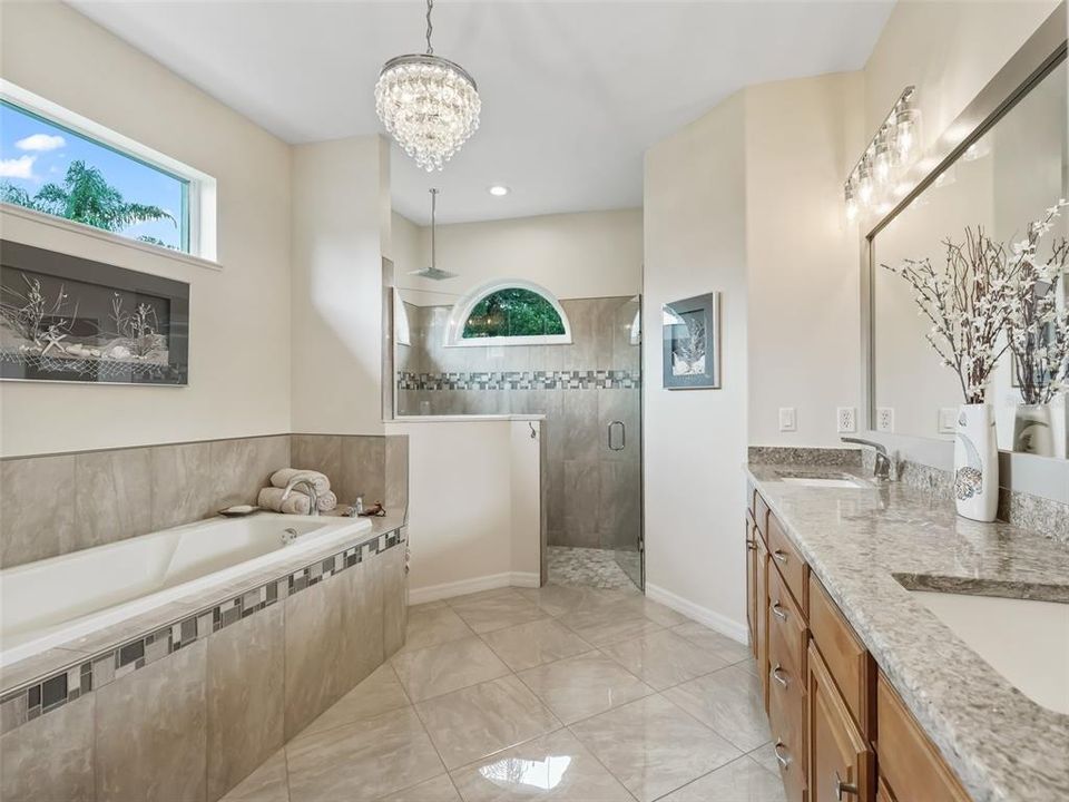 The primary bathroom has a large soaking tub, double sinks with lots of counter space and a walk in shower.