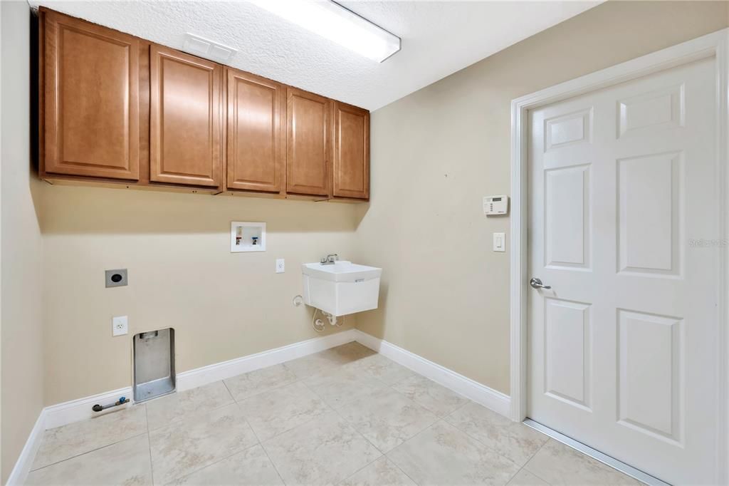 Oversized laundry room leading to the garage
