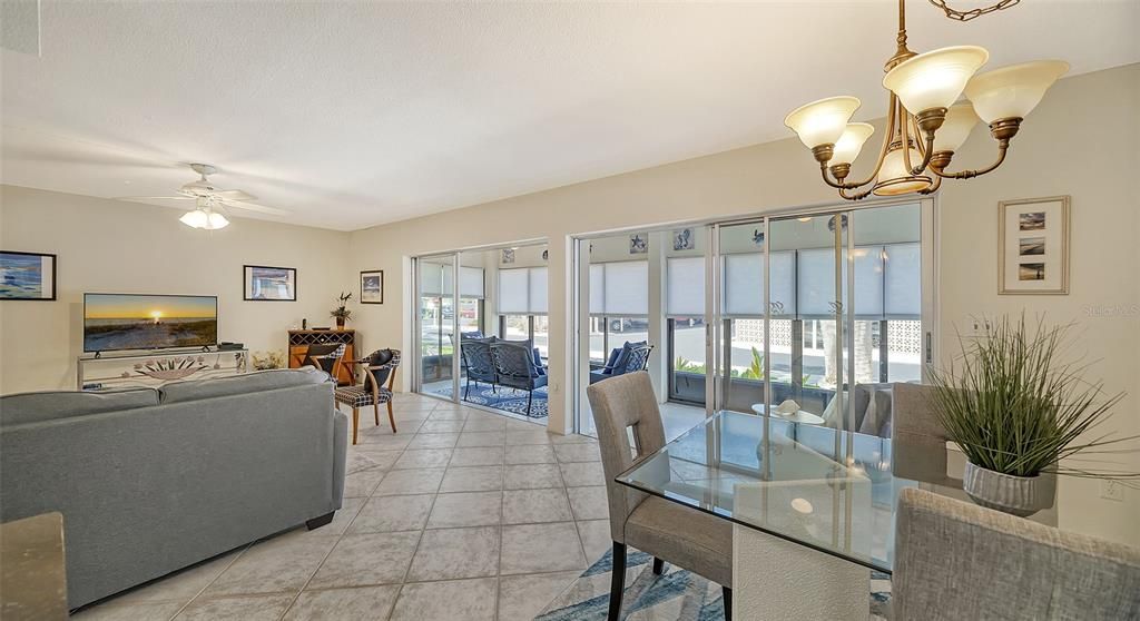 Dining and living rooms feature floor to ceiling sliders leading to west facing lanai.