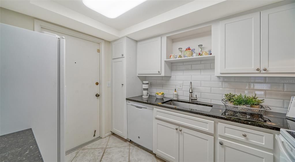 Kitchen and back door of the unit.