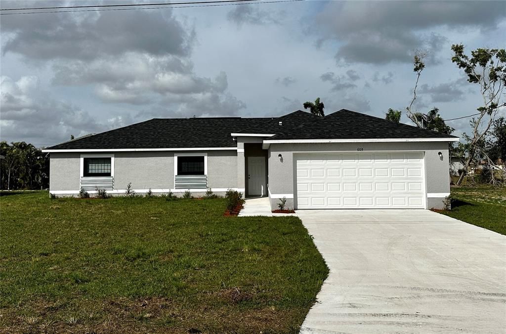 605 SE 2nd St, Cape Coral, FL 33990 - Front lawn and Garage