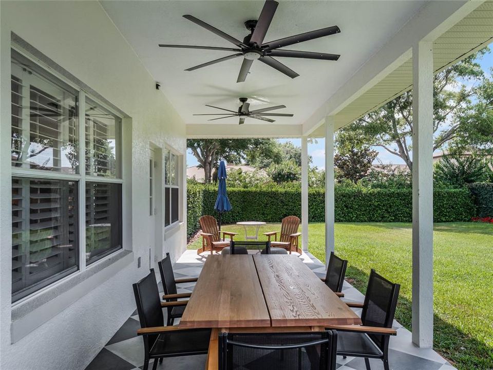 Covered Lanai with designer tile and designer exterior ceiling fans.