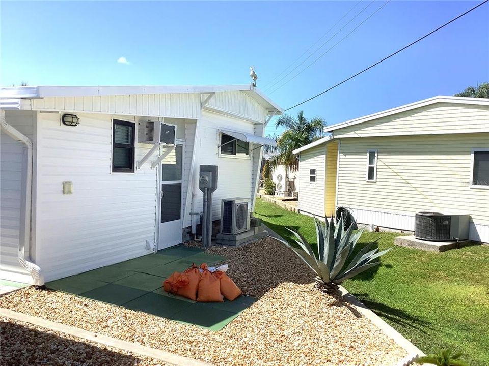 Back (Note AC unit is for shed only.  Mini Split system for the home.)