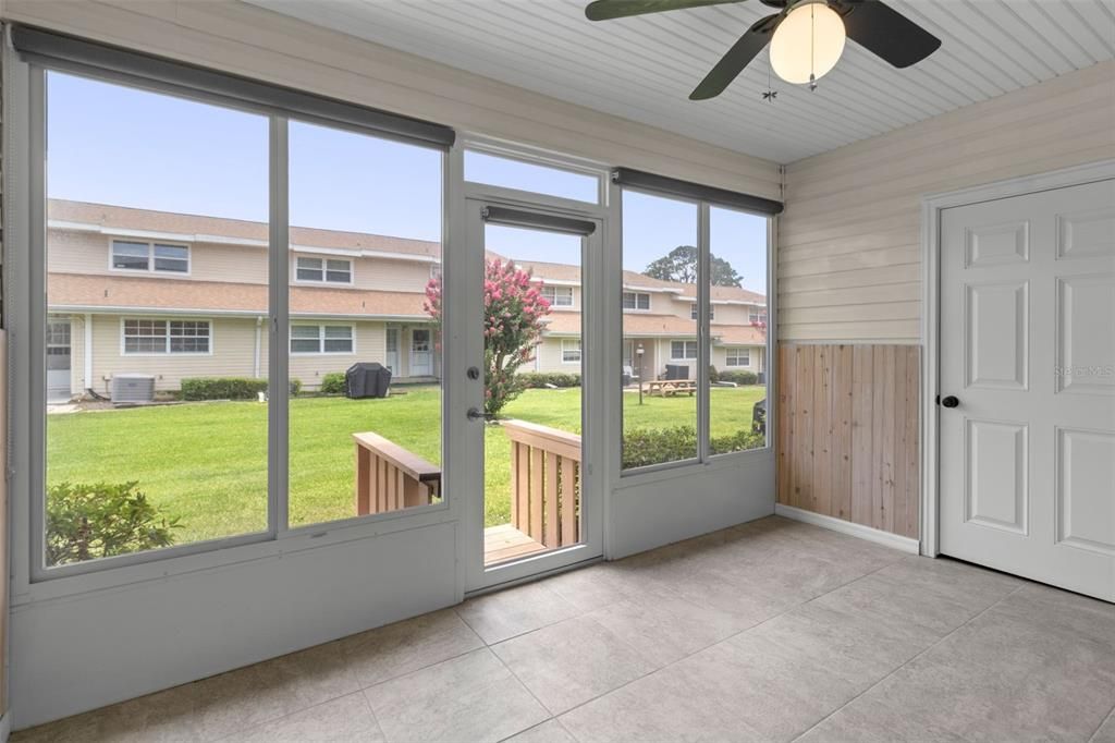 Condo enclosed porch with large closet.