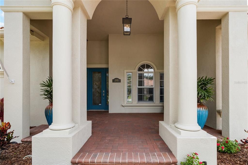 Grand entrance with brick paver walkway, large aristocratic pillars welcoming you into charm and sophistication truly a luxury lifestyle.12428 Daisy Pl Bradenton FL 34212