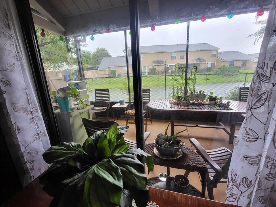 View of Screened Patio and Canal from Living Room