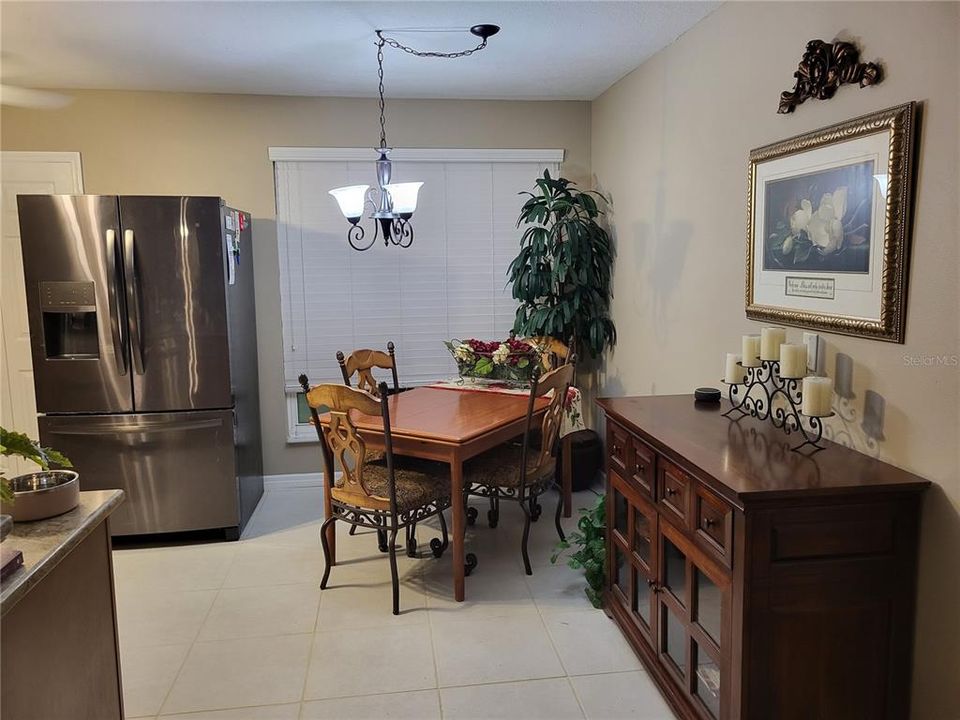 Large Refrigerator to Left of Dining Area