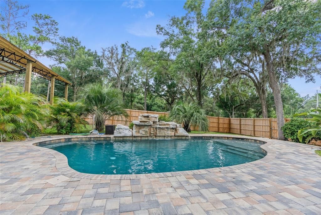 custom heated saltwater pool with waterfall