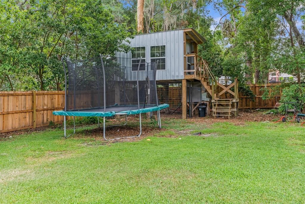 tree house and chicken coop underneath