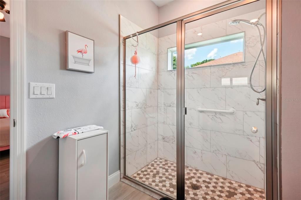 Bathroom 2 showing granite countertop on single vanity.