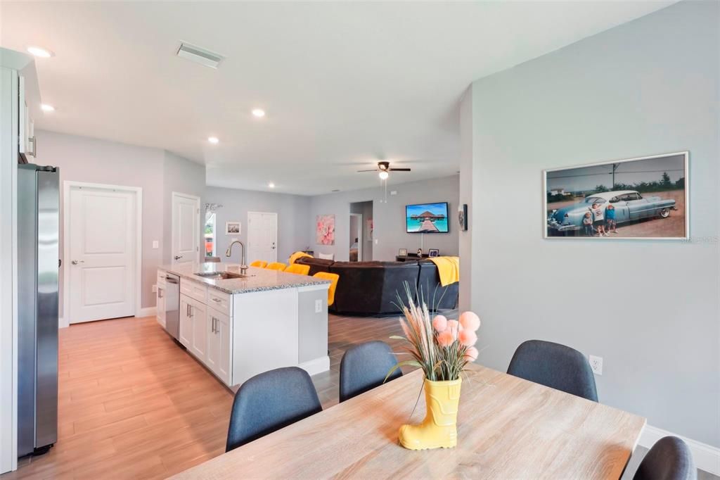 Kitchen facing great room, laundry room, and pantry.