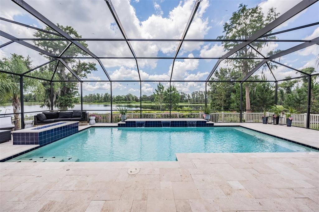 pool with propane fire pit and travertine pavers