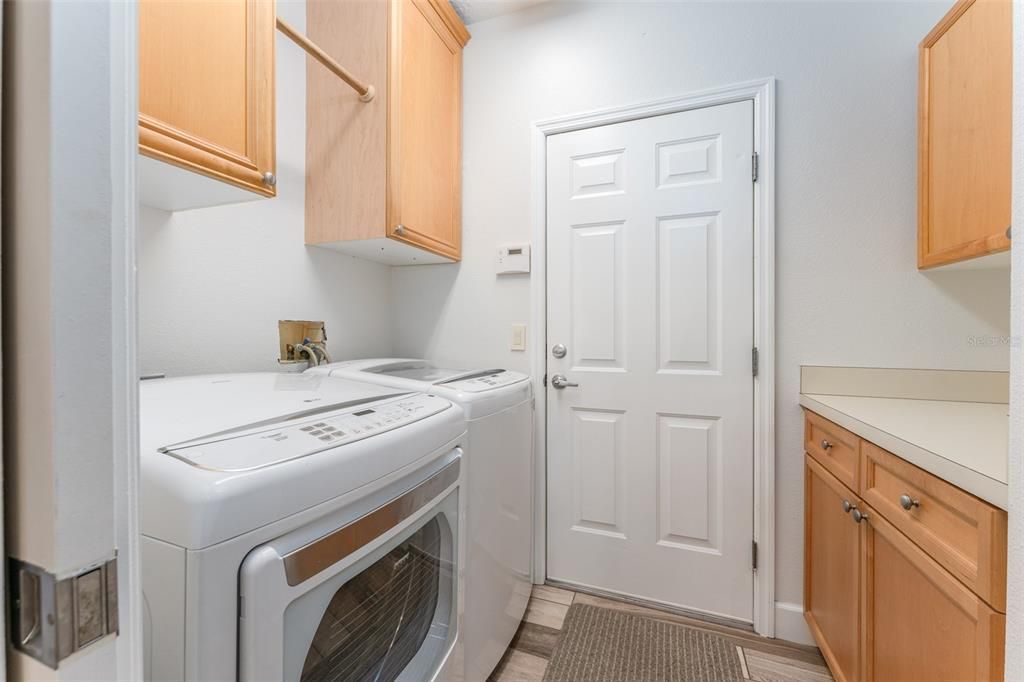Laundry Room with built in cabinetry, Counter Space, Washer & Dryer that Convey with the Home
