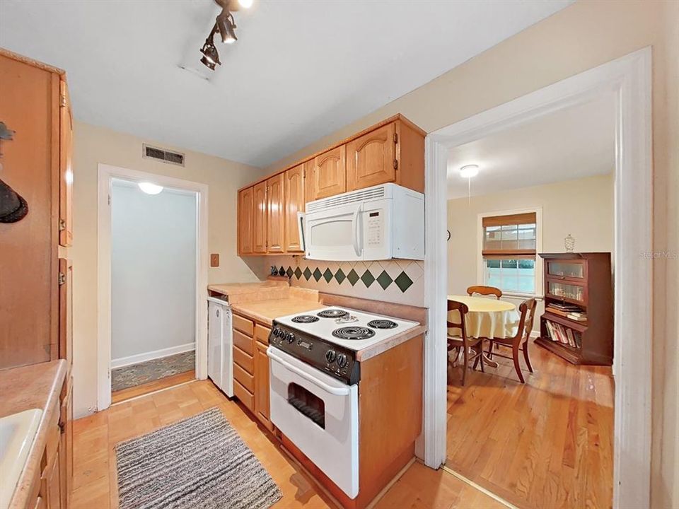 The kitchen is convenient to the nearby Dining Room so you won't miss a thing while preparing meals.