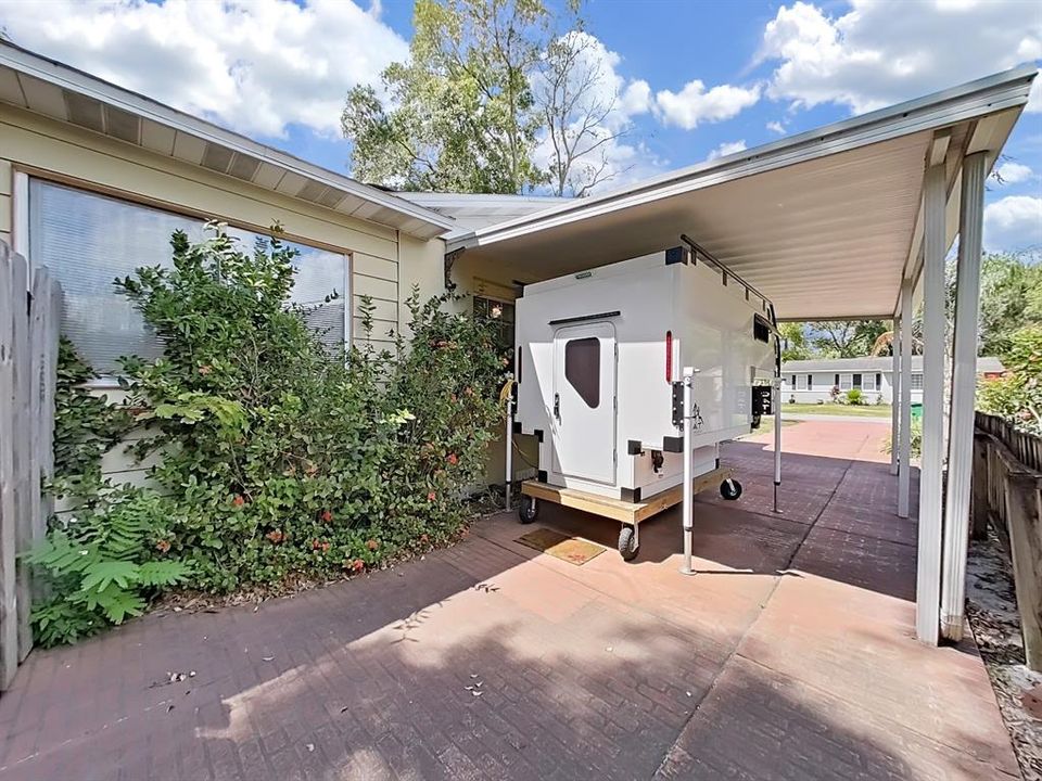 Covered Carport and additional driveway space.