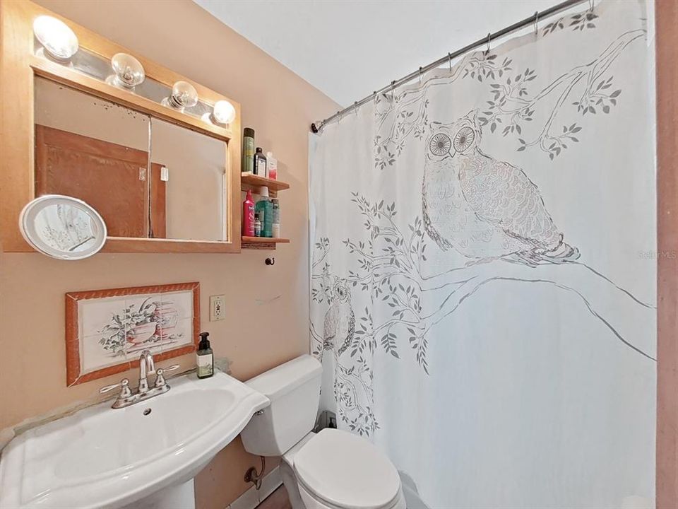 Bathroom with tub/shower combo.