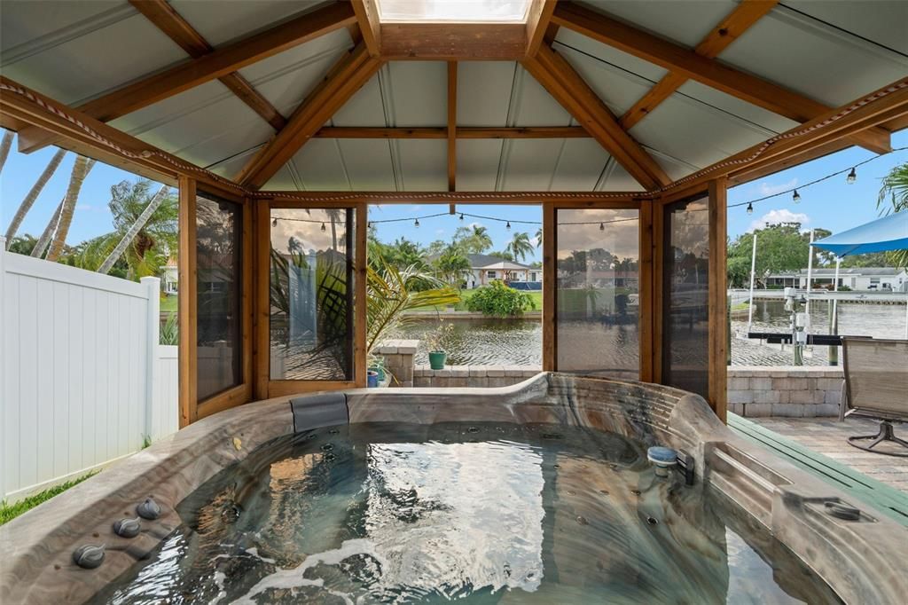 Spa with metal roof and surrounding windows