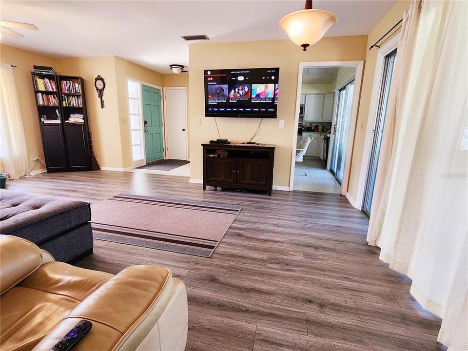 Living Room with Vinyl Laminate flooring and bay window