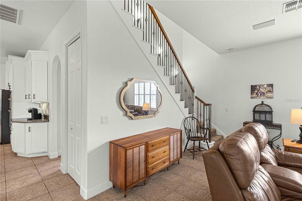 Living Room and Staircase Leading to Bonus Room