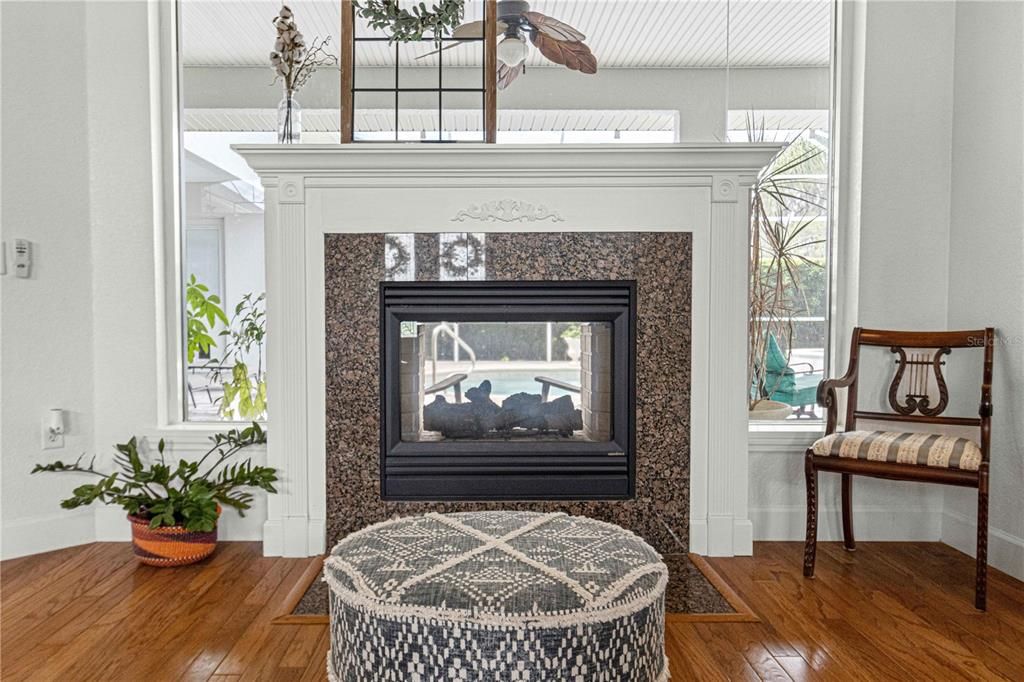 Double-Sided Fireplace Located in Formal Living Room