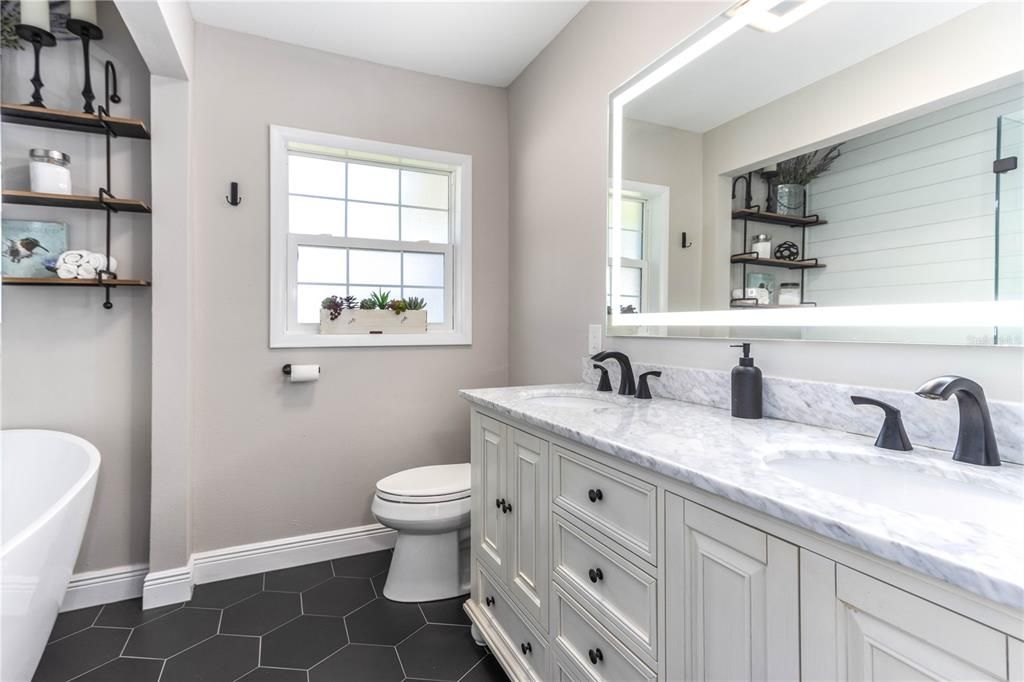 Double vanity with lighted mirror