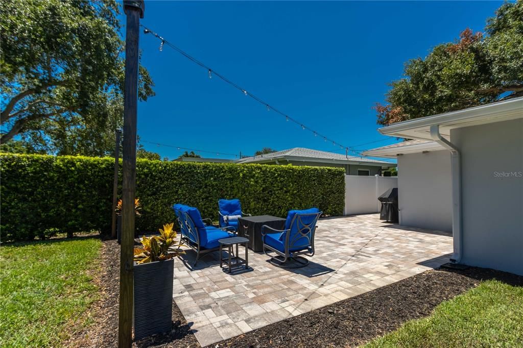 Pavered patio with twinkling Edison lights