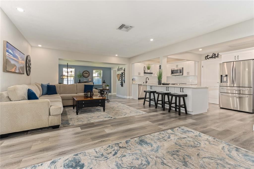 Open floor plan with luxury vinyl flooring throughout