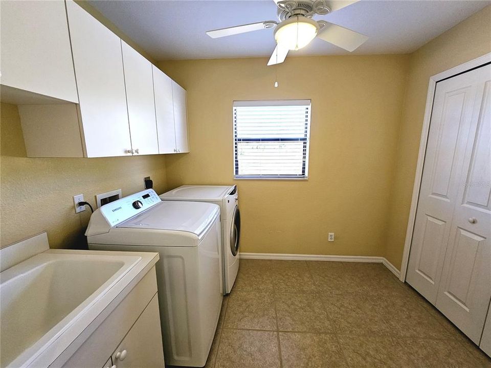 Laundry room with storage area