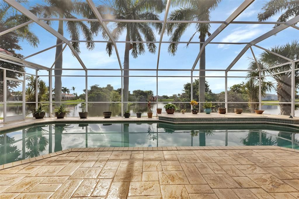 View of  pool and lake from lanai