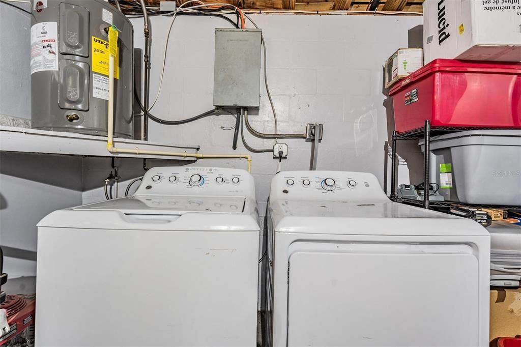 Washer and dryer located in the one car garage.