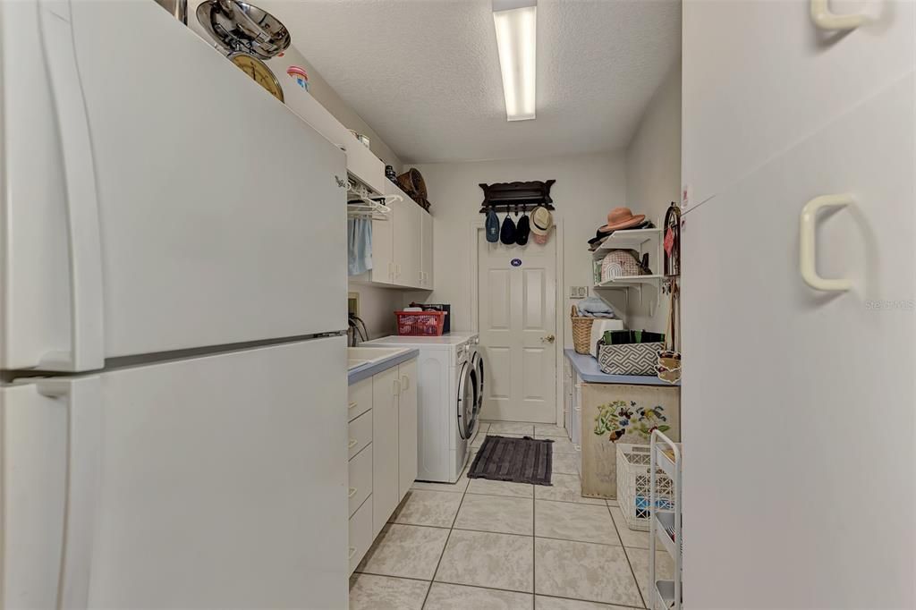 Laundry is spacious enough for a second refrigerator AND a mud sink