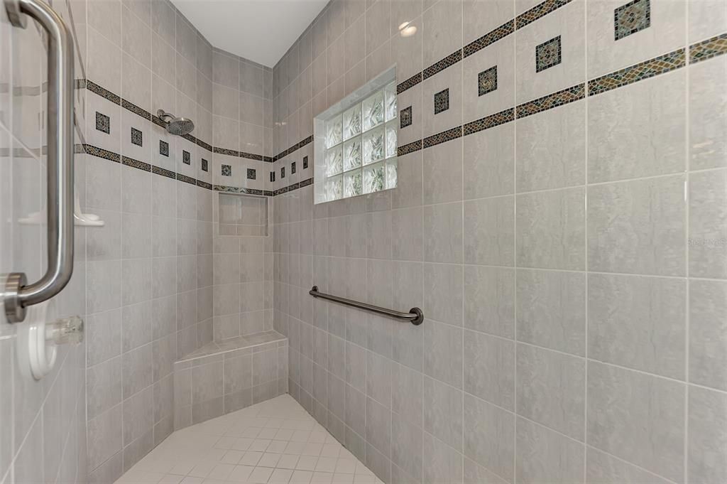 Fully tiled w/glass block for natural light and easy clean up