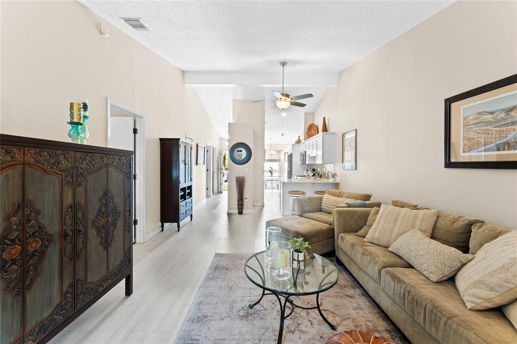 Living room and view to entry and kitchen