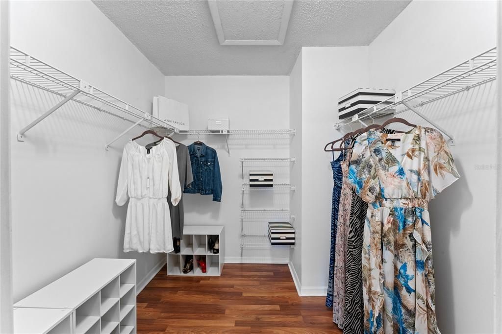 Primary bedroom walk in closet