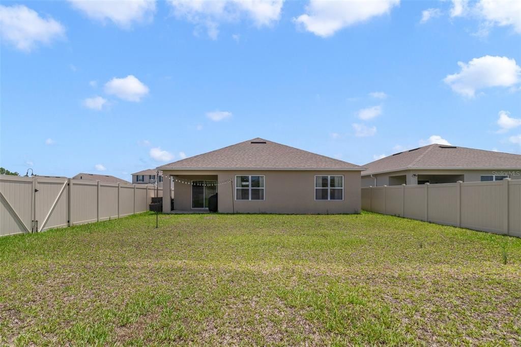 This single story home has 4-bedrooms and 2-full baths, TILE and WOOD LAMINATE FLOORS throughout and the large backyard is fully fenced with a side entry gate.