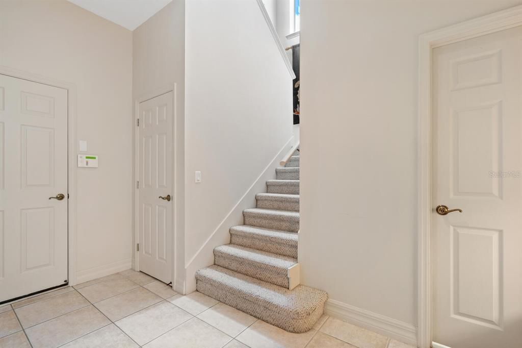 Back door entry foyer and stairs to 2nd level