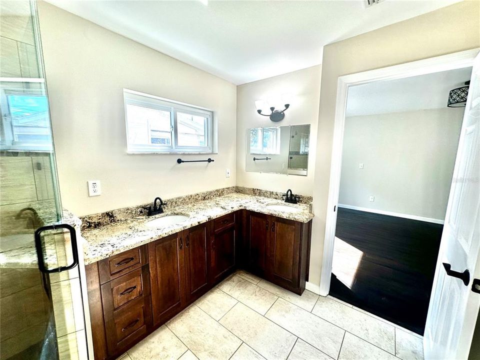 Primary Bathroom with granite countertops