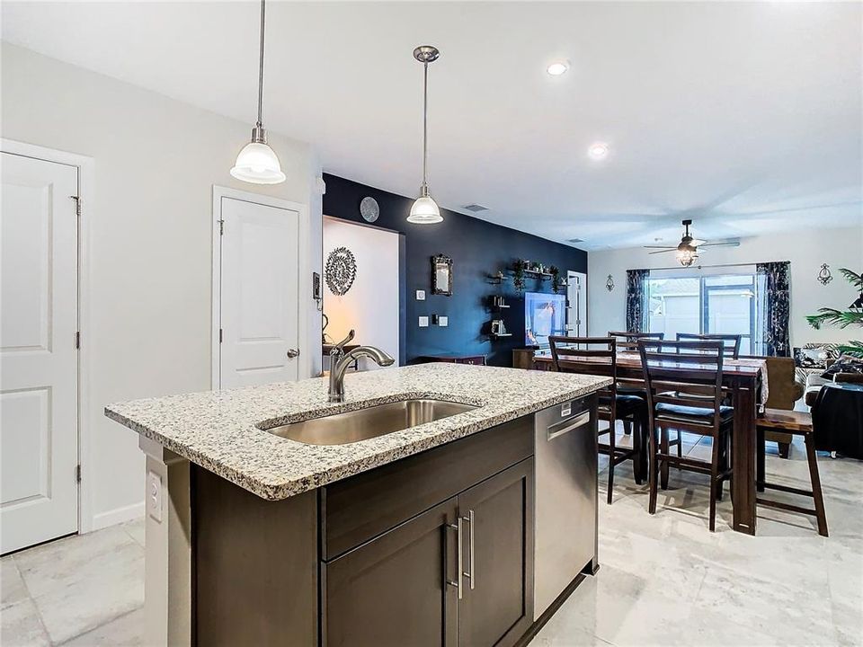 Kitchen leads to dining area and family room