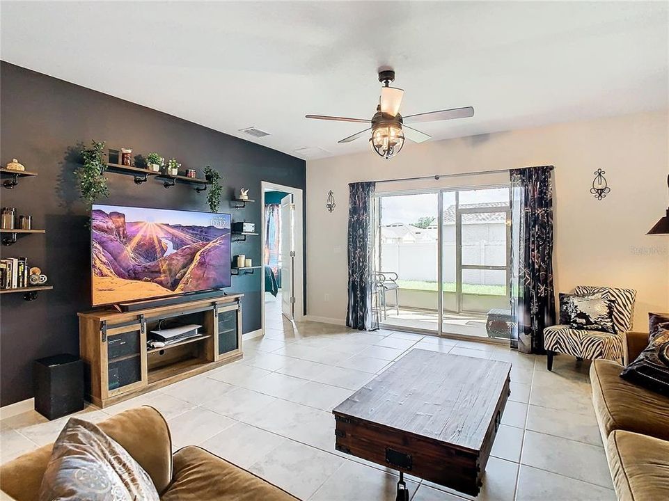 Family room with sliders to screened patio