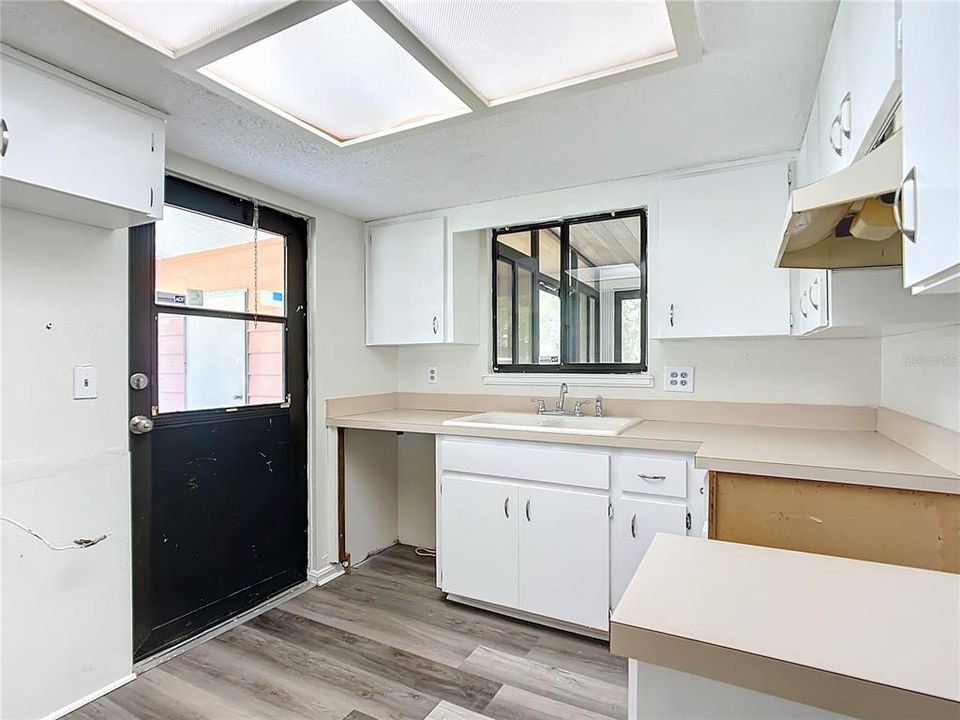 Kitchen with entry to carport