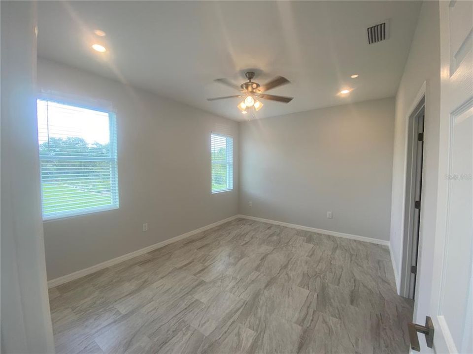 Primary bedroom with recessed lights