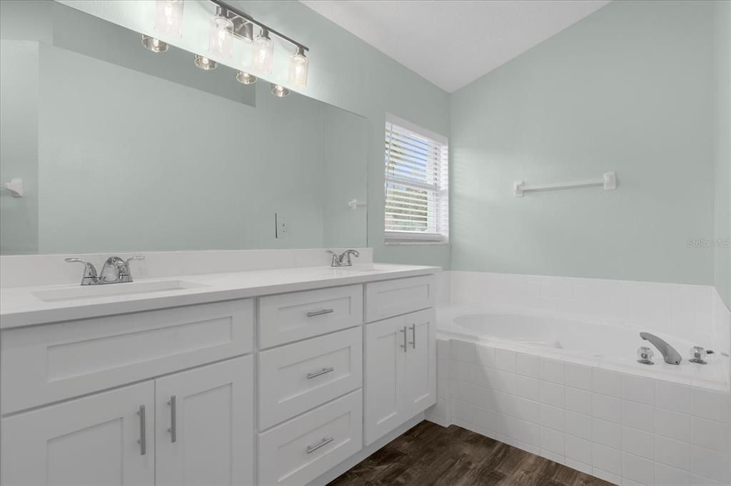 Primary Bathroom with brand new custom cabinetry and dual vanities