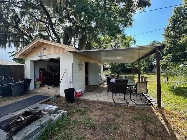 1 car detached garage with patio area