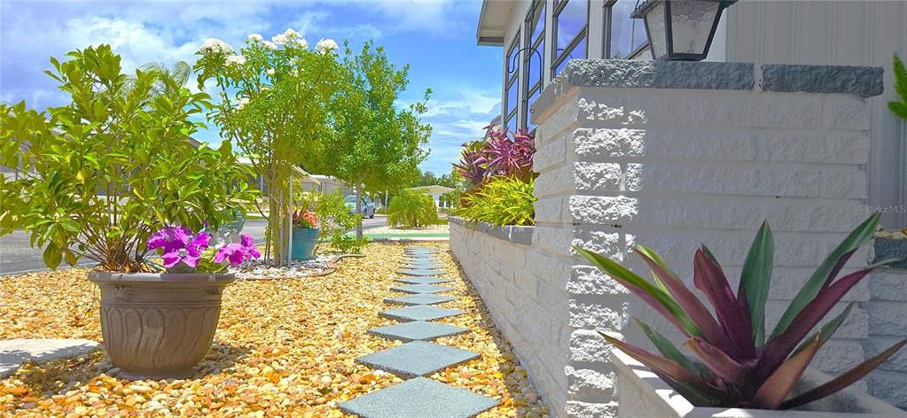 Gorgeous path & flower bed with a retaining wall