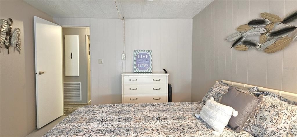 Guest bedroom includes ceiling fan & walk-in closet